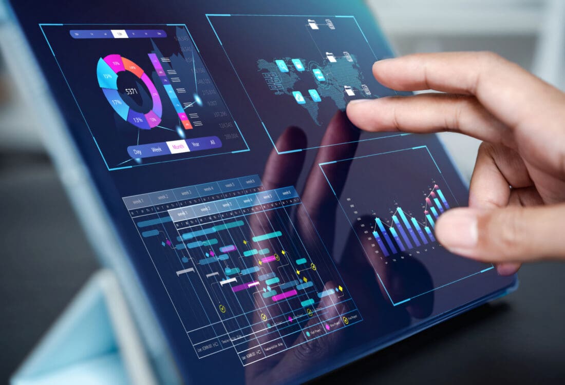 Analyst working with computer in Business Analytics and Data Management System to make report with KPI and metrics connected to database. Corporate strategy for finance, operations, sales, marketing